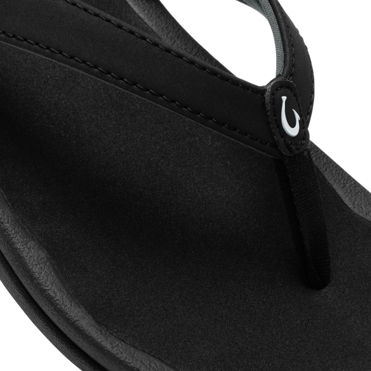 Black neoprene shoulder bag with curved body, dual handles, and white logo detail on strap.