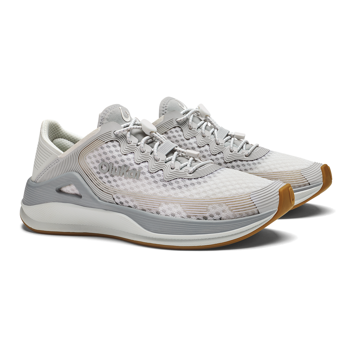 White and gray athletic running shoe with tan heel accent and mesh upper.